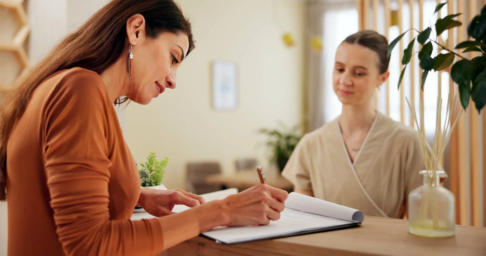 Healthcare professionals comparing records in an office